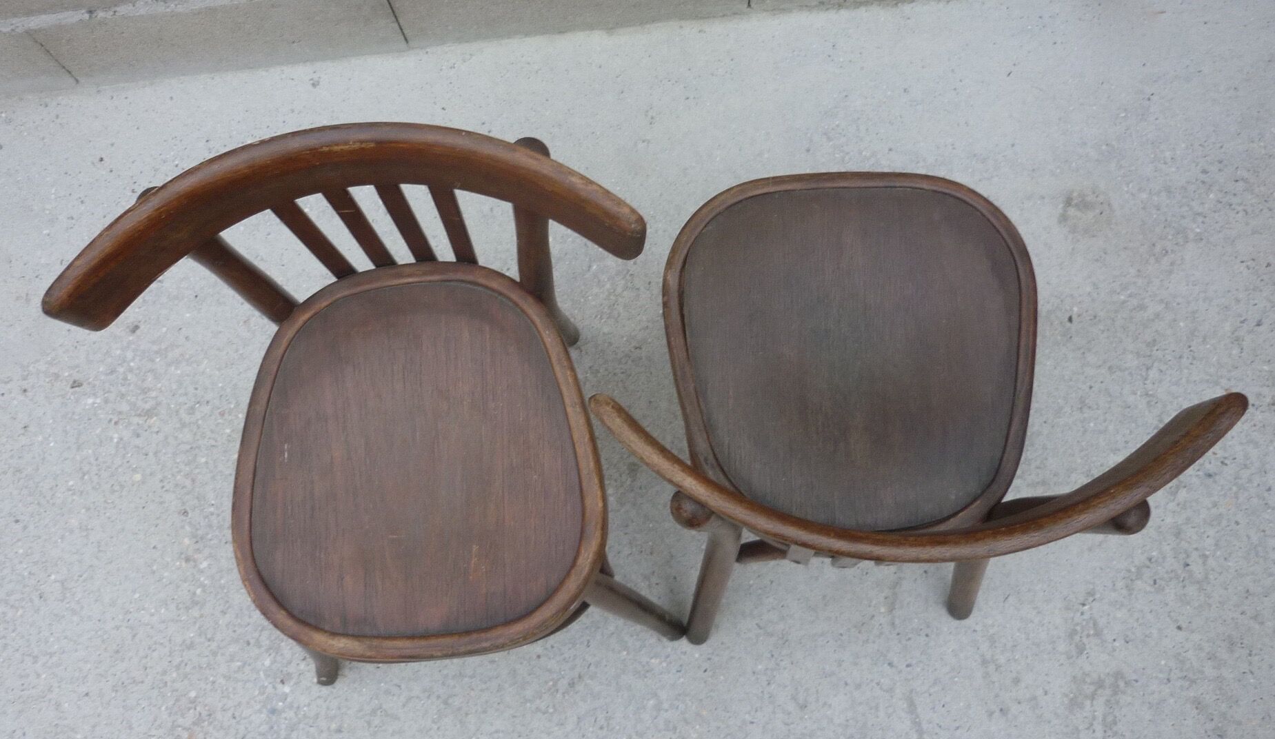 Pair of old bistro chairs with dark patina