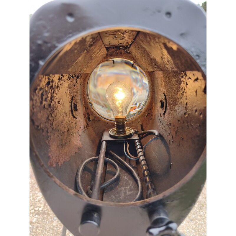 Spotlight on wooden and chrome tripod.