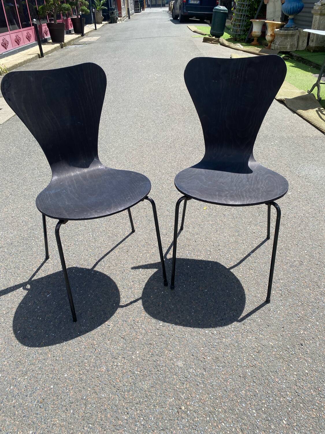 Pairs of wooden chairs