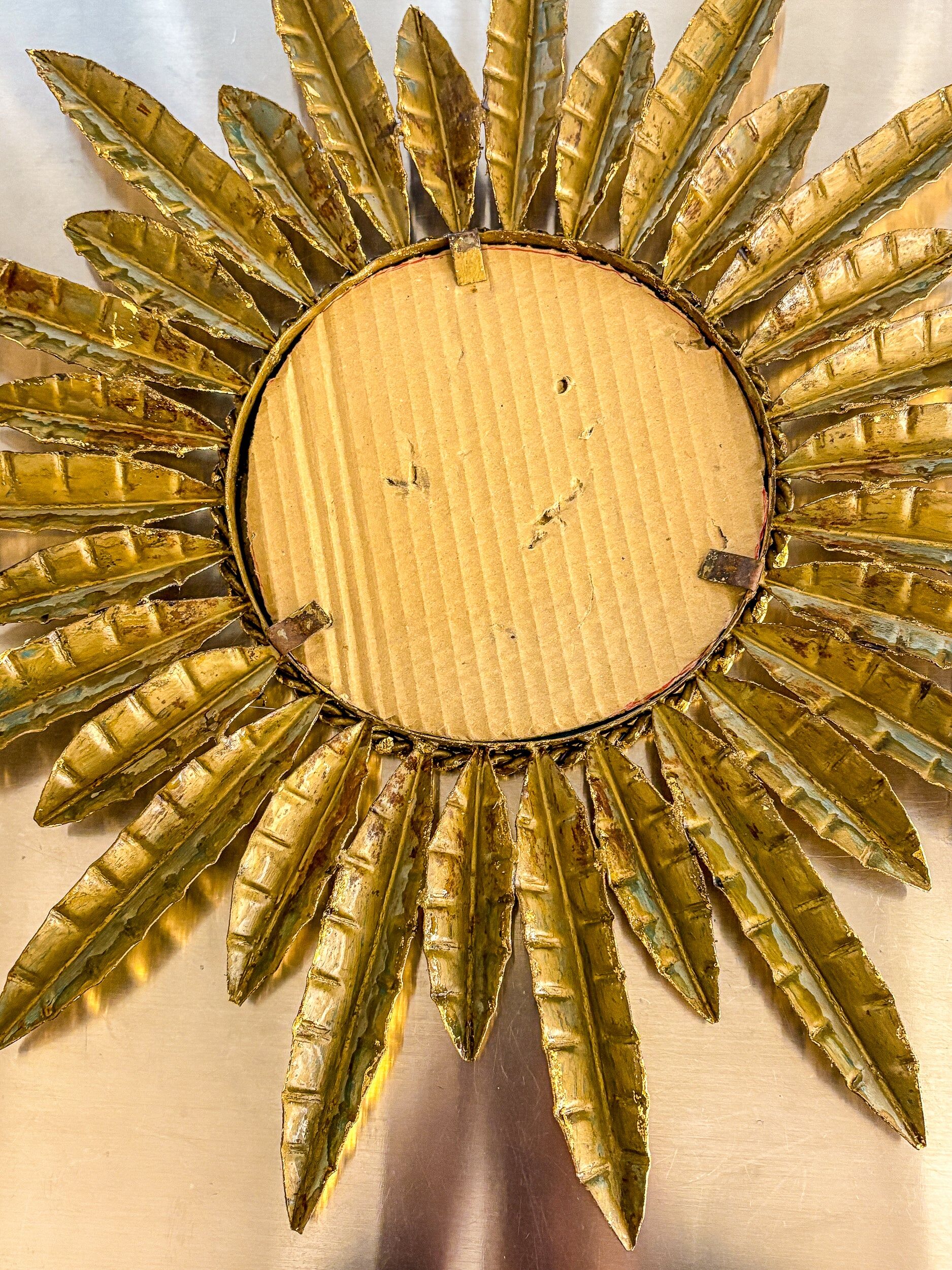 Midcentury modern sunburst wall mirror – gilt metal, France 1960s