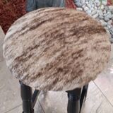 Black bar stool and skin of cattle.