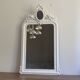 Mirror from the late 19th century with a decorated pediment. 112x66.