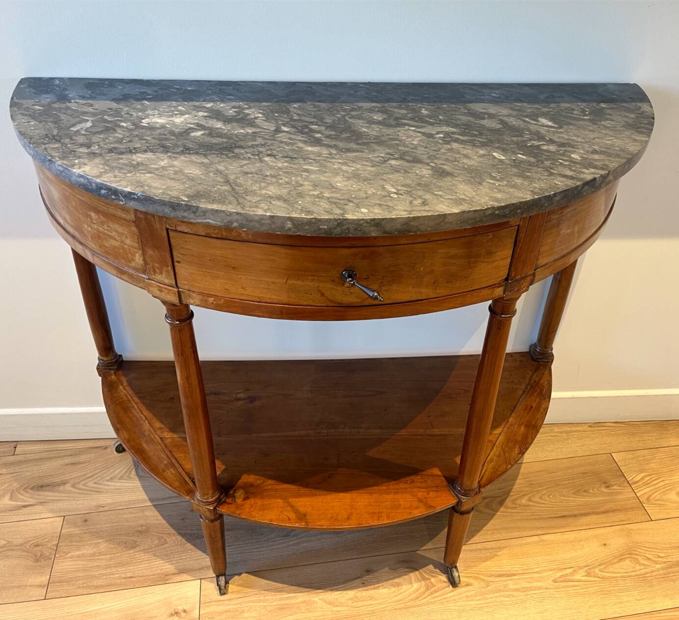 Half-moon console in mahogany with a marble top in Louis XVI style.