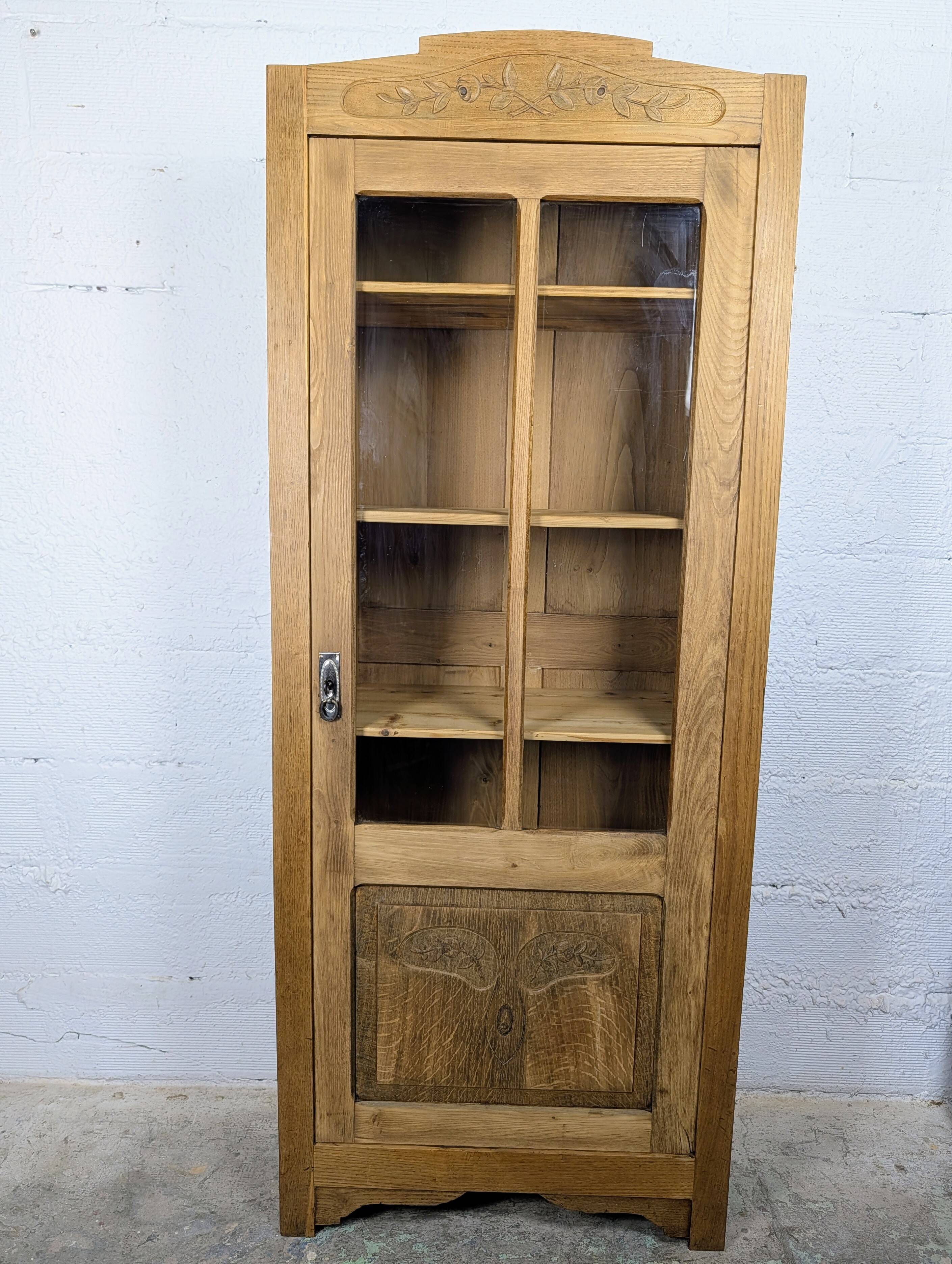 Glass-fronted cabinet from the 1930s-1940s.