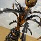 Large pineapple table lamp in carved black and gold wood, France, early 20th century.