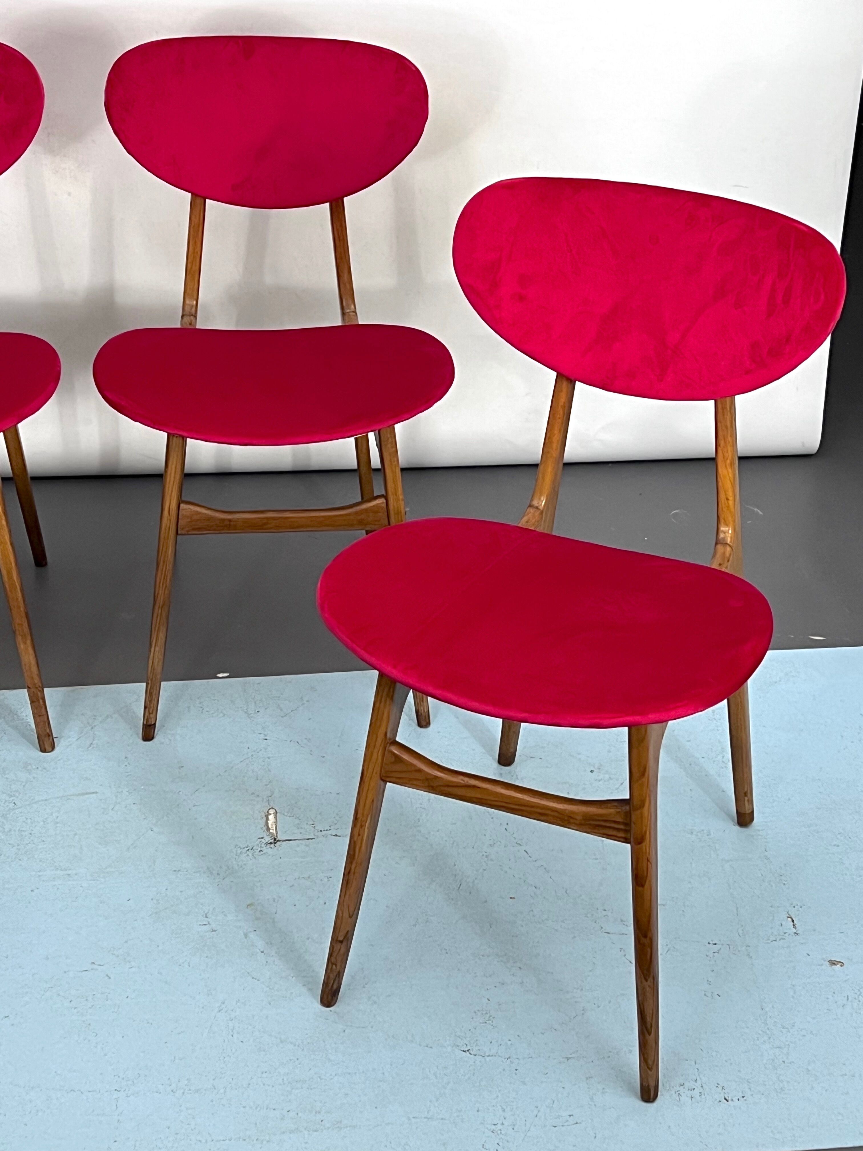 Set of four red velvet and wood dining chairs, Italy 1950