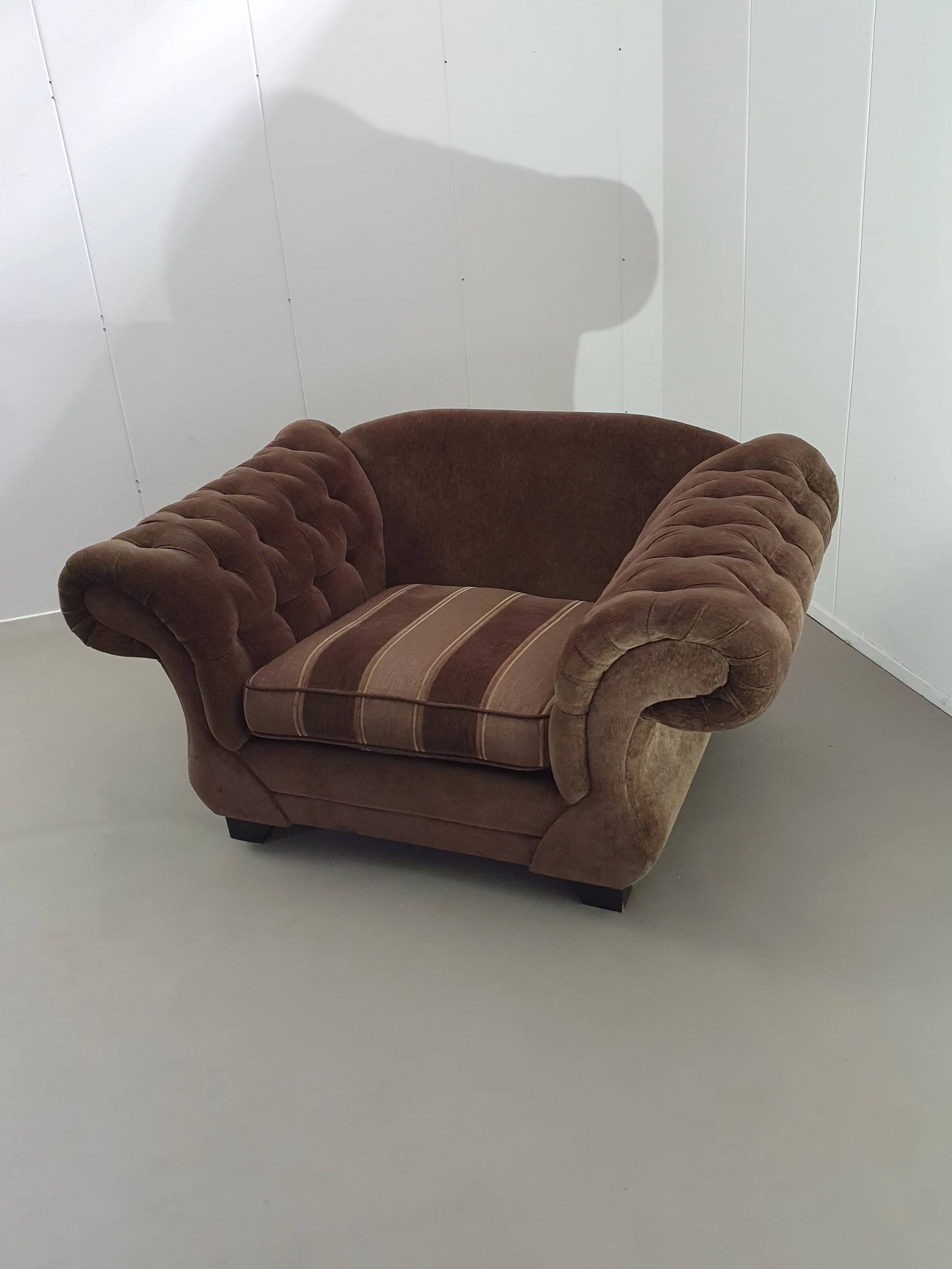 Large weighty love seat with the original matching cushions. Marked "Handmade in Holland"