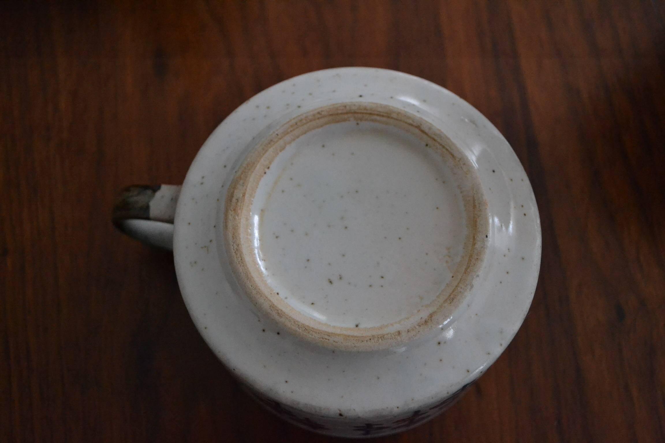 Stoneware cup with Japanese pattern