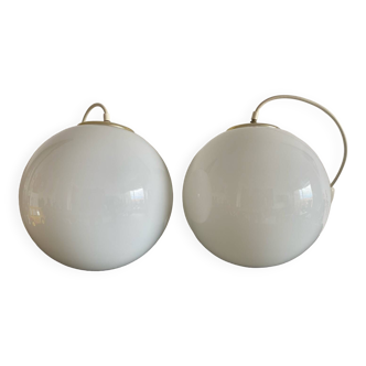 Pair of white Parscot globe pendant lights