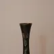 Vintage brass soliflore vase with black, red, and green floral decoration – H 18 cm