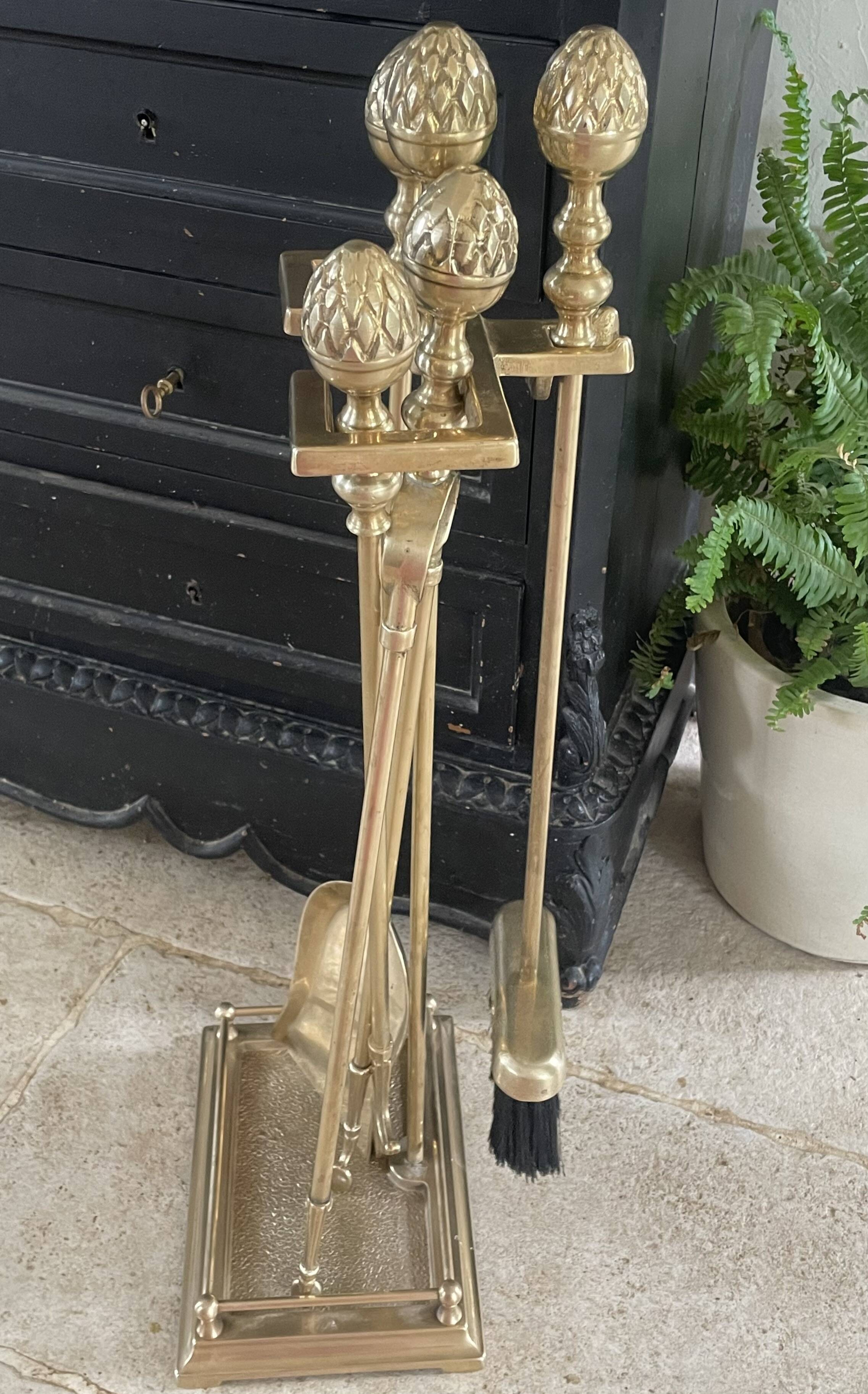 Brass fireplace tools in the style of Maison Baguès.
