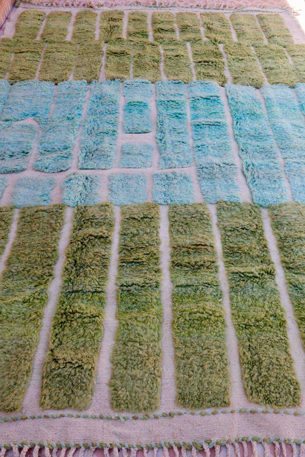 Almond green and blue green Moroccan rug with modern reliefs