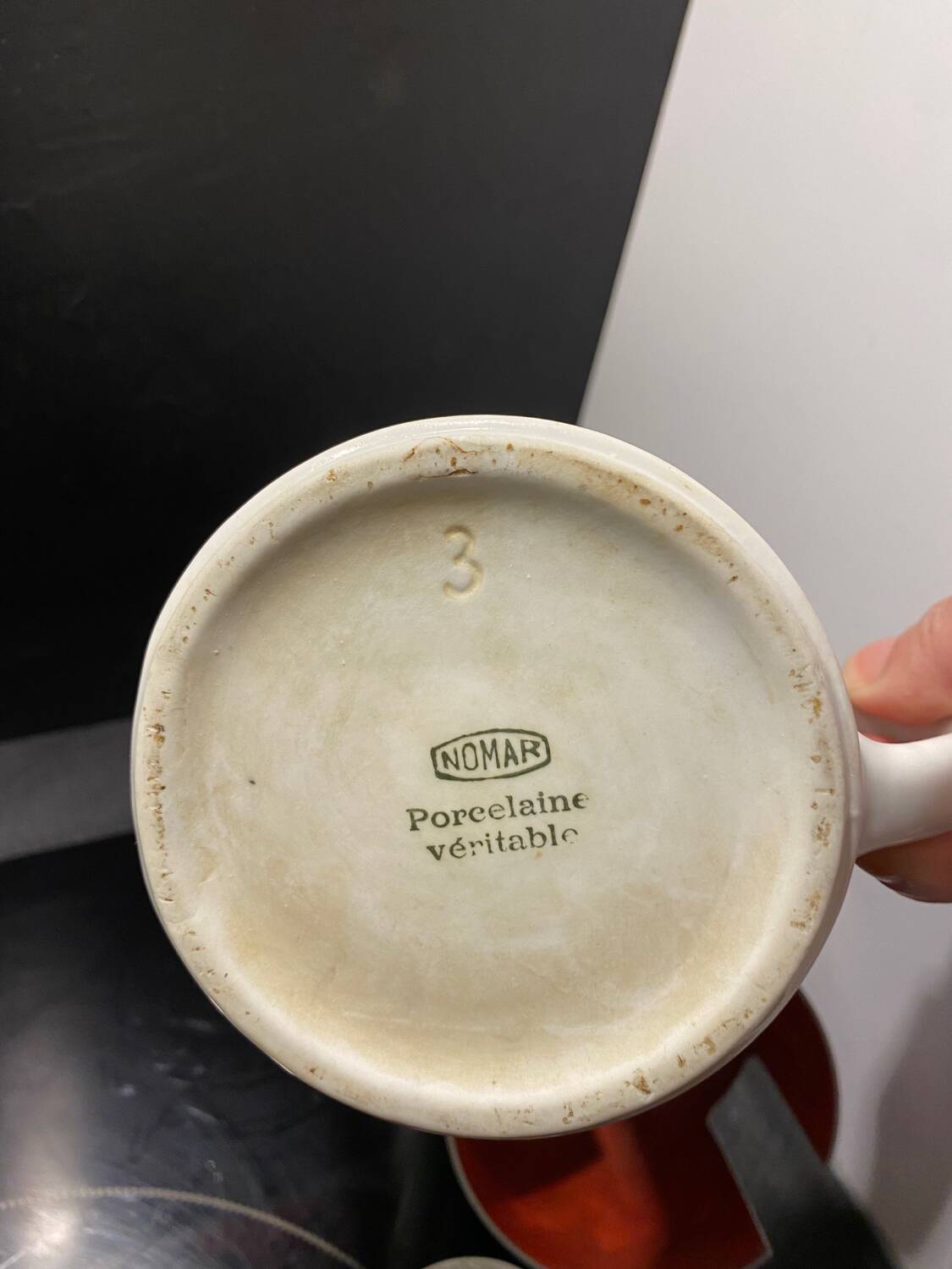 Nomar porcelain and steel teapot