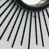 Vintage black and gold metal sun mirror from the 1960s.