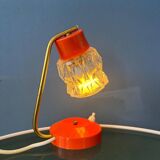 Small orange desk lamp with clear crystal glass shade