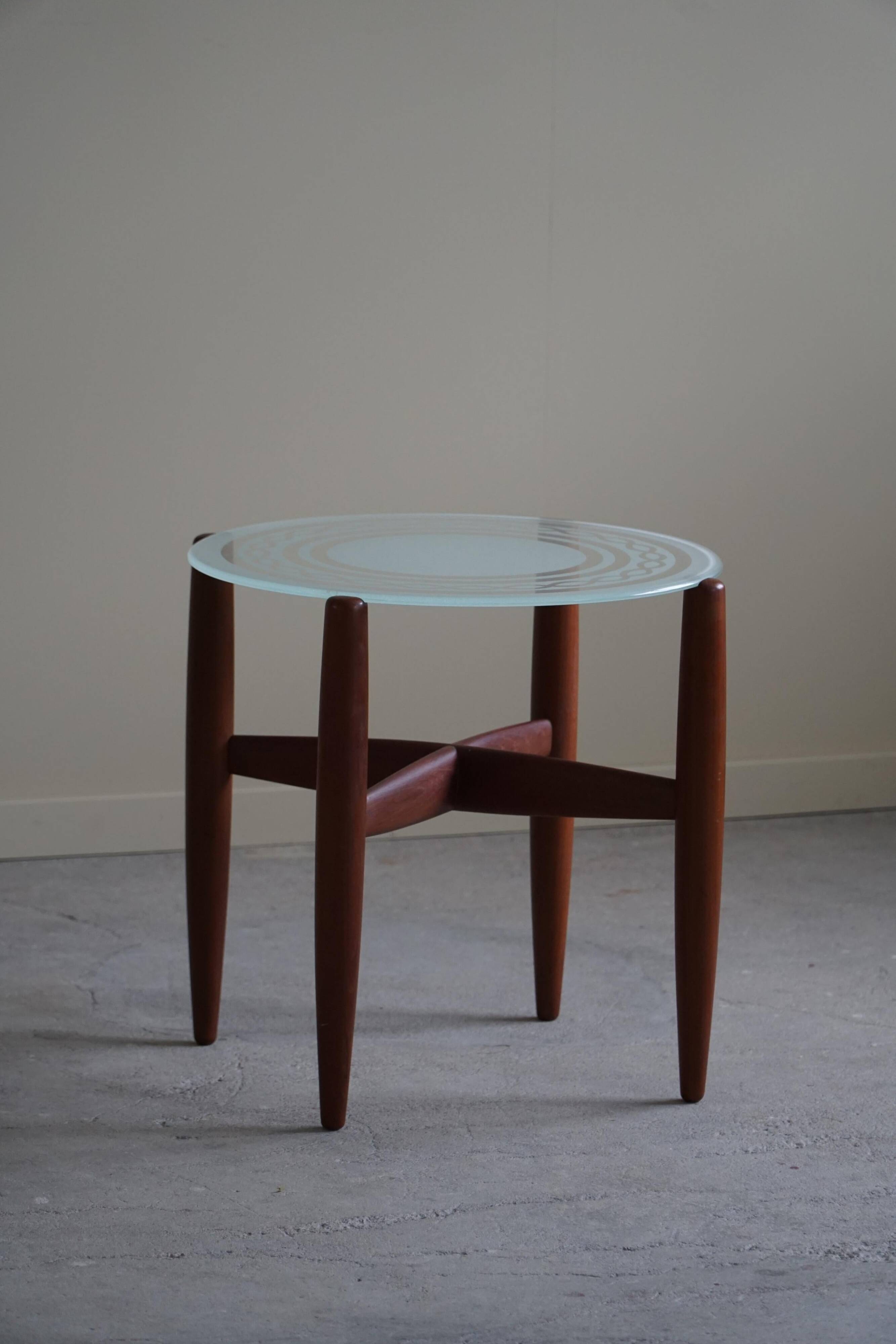 Teak and glass side table, mid-century Danish design, made in the 1960s.