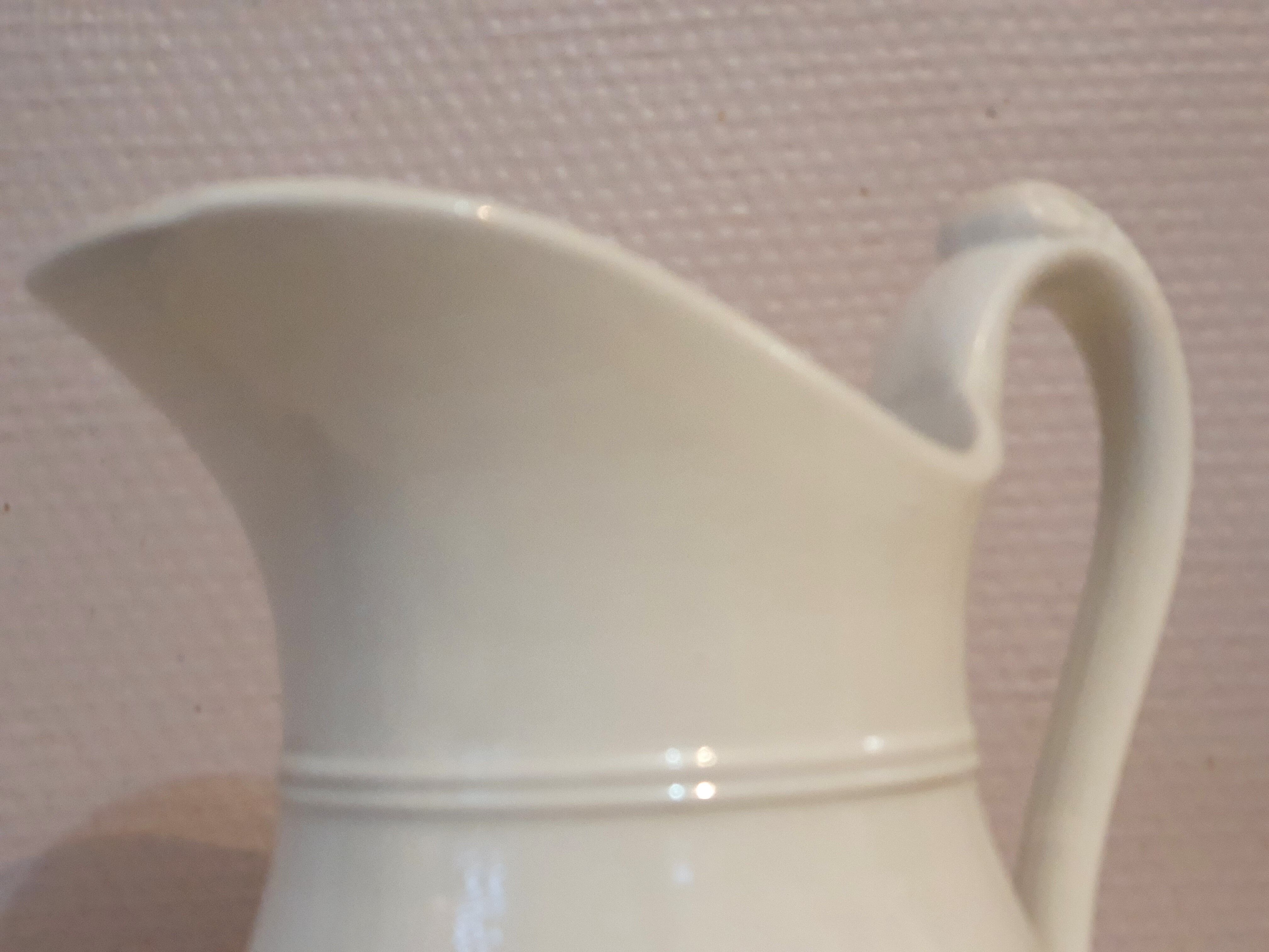 Antique pitcher pitcher in white porcelain