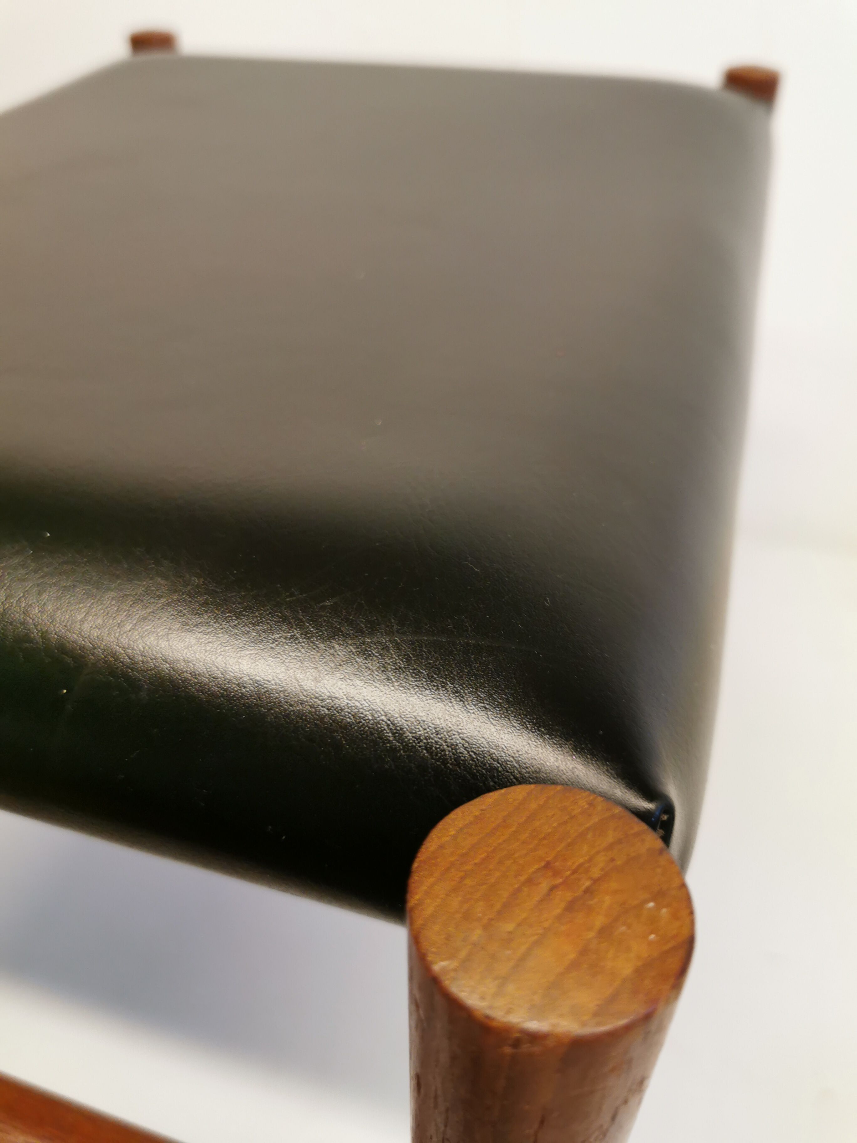 Danish designed footstool, in teak and black skai. Made at Spøttrup furniture factory in the 1960s.