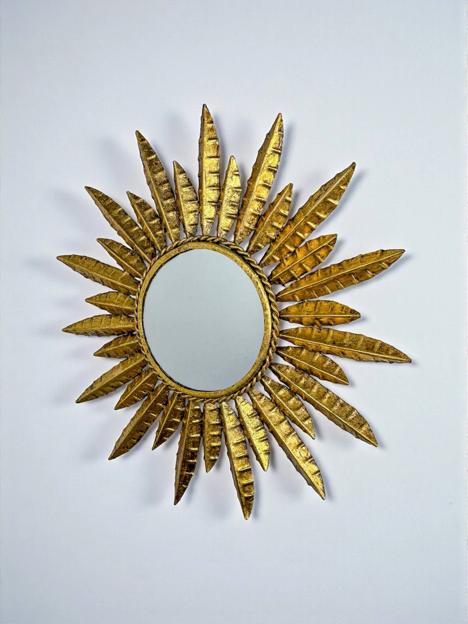 Midcentury modern sunburst wall mirror – gilt metal, France 1960s