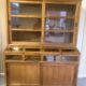 Large antique haberdashery cabinet with glass doors.