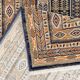 Black and beige Persian rug