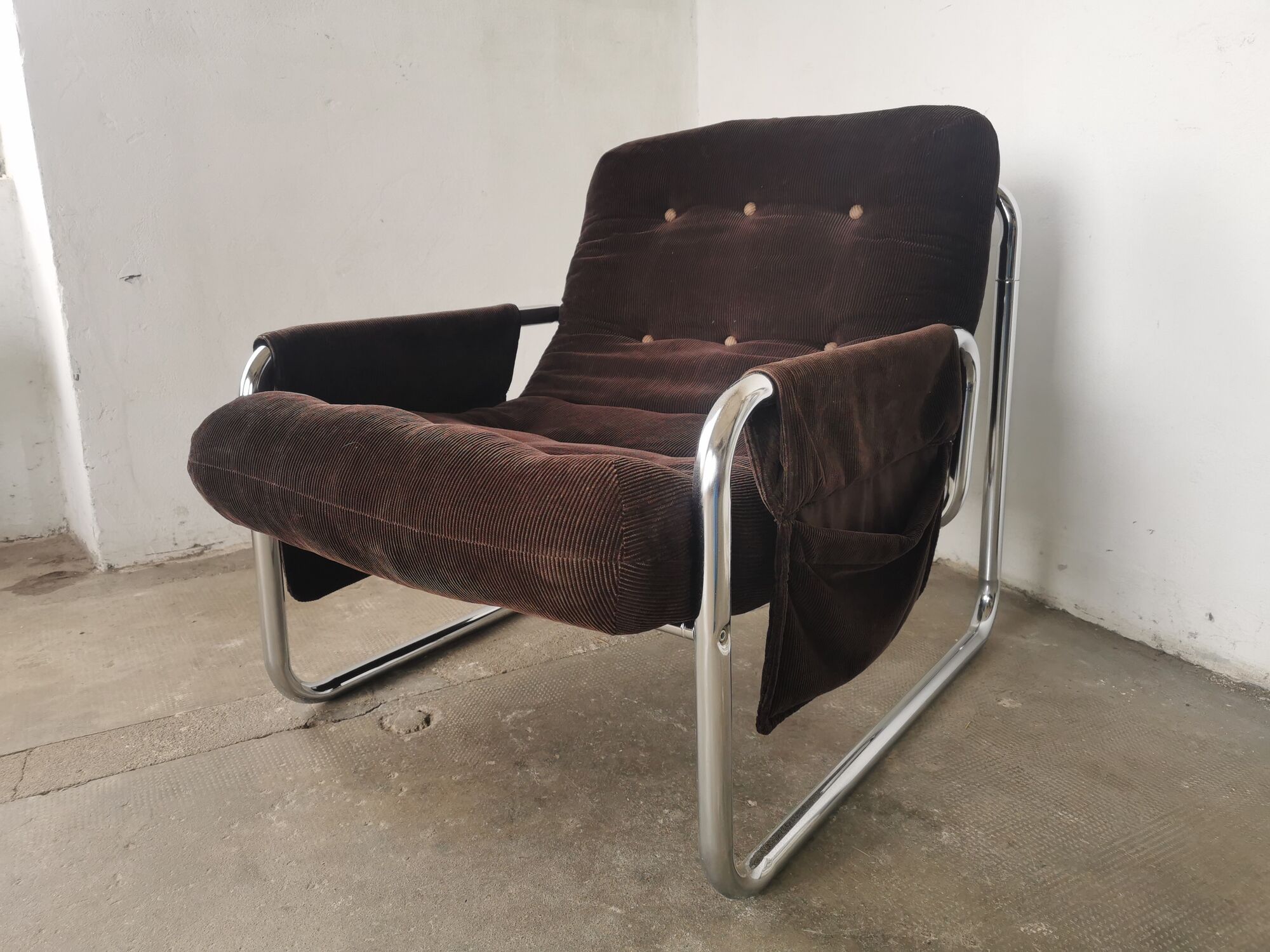 Velvet and tubular metal armchair 1980