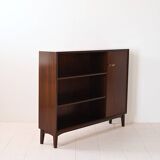 Vintage bookshelf with a door