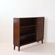 Vintage bookshelf with a door