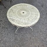 Old garden table in solid wrought iron