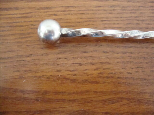 Silver metal sprinkling spoon