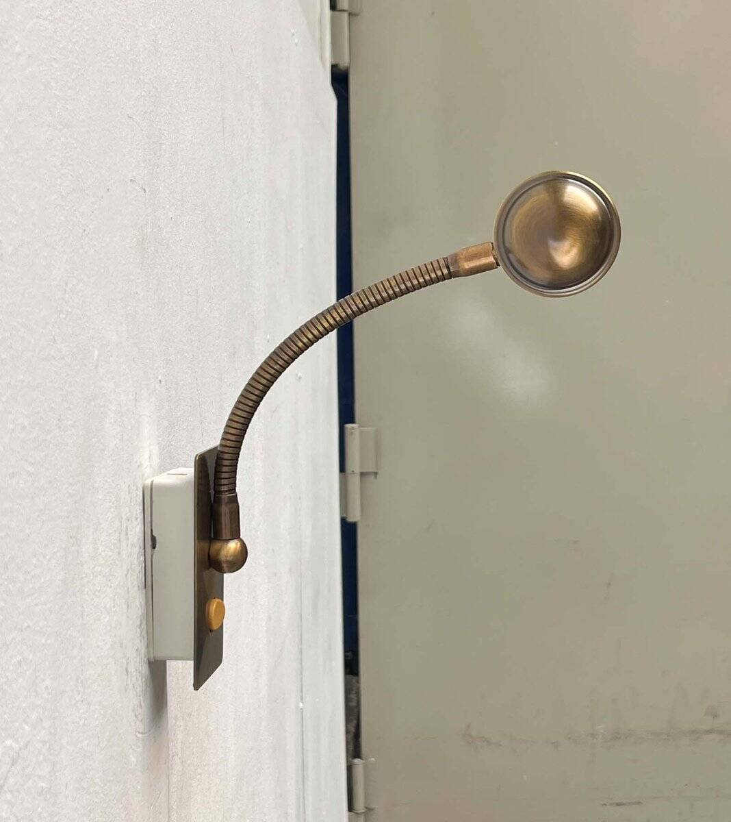 Vintage German brass patinated wall lamp with a gooseneck design by Honsel, 1970s.