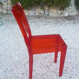 Orange design chair in polycarbonate plexiglass