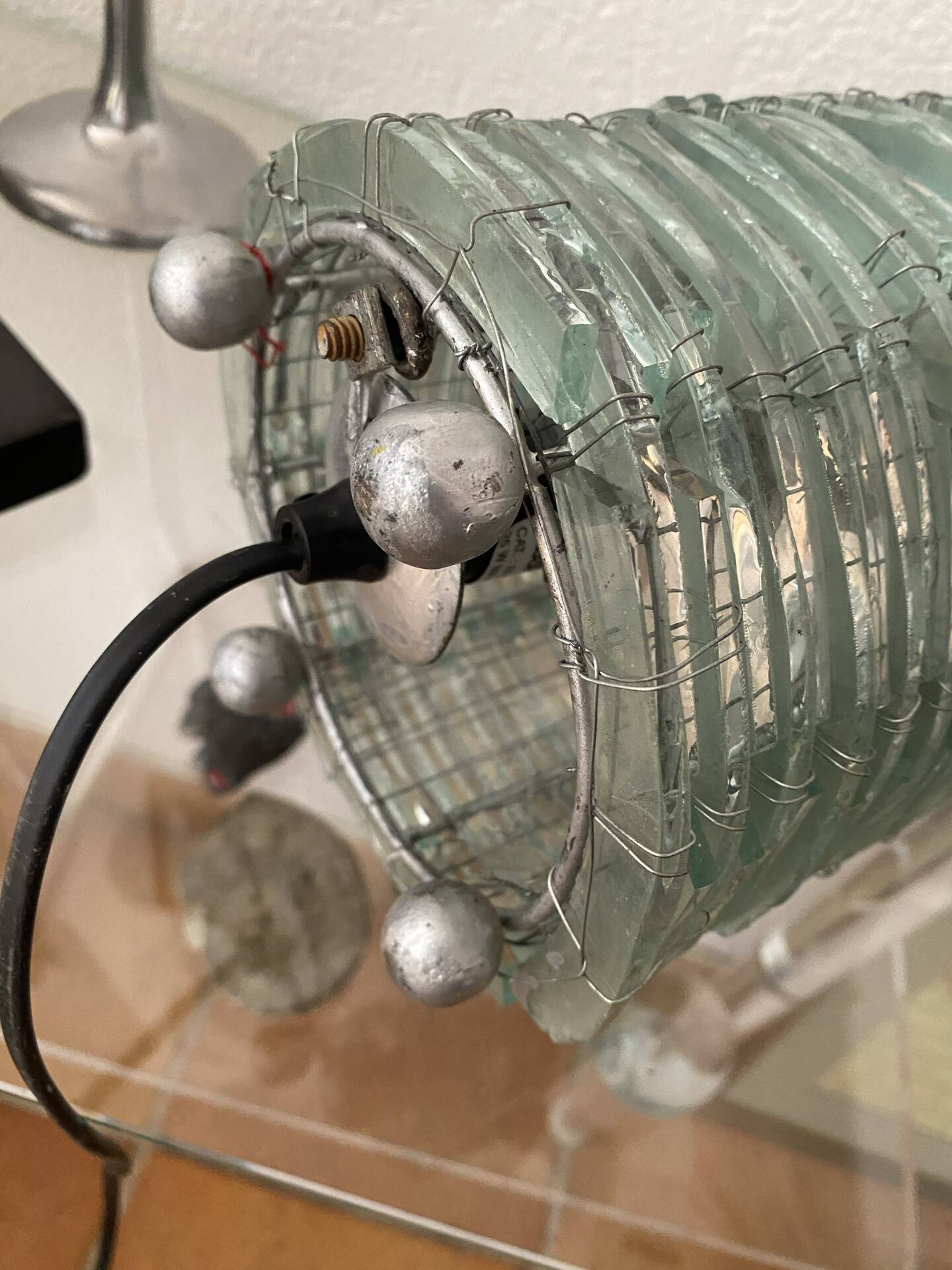 Blue-tinted glass lamp and wire.