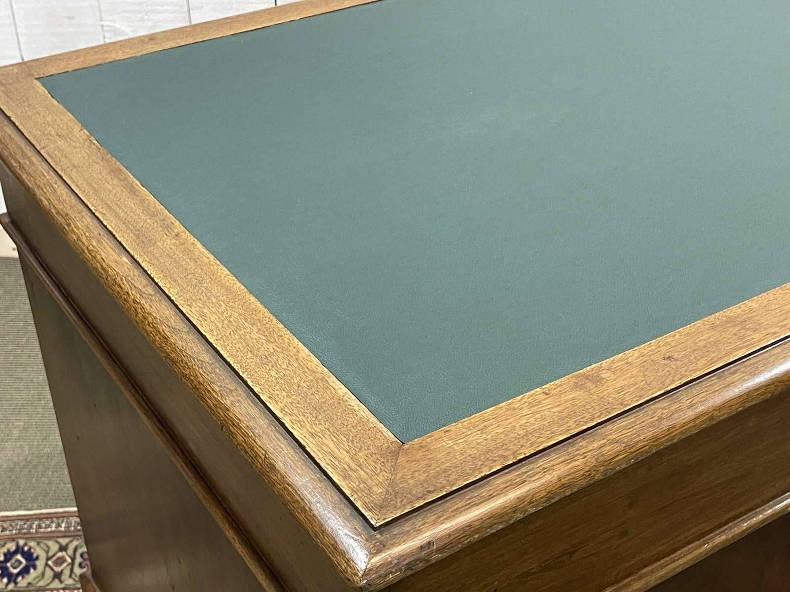Late 19th century English mahogany desk with pedestals and leather top