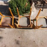 3 vintage bridge chairs with rounded armrests.