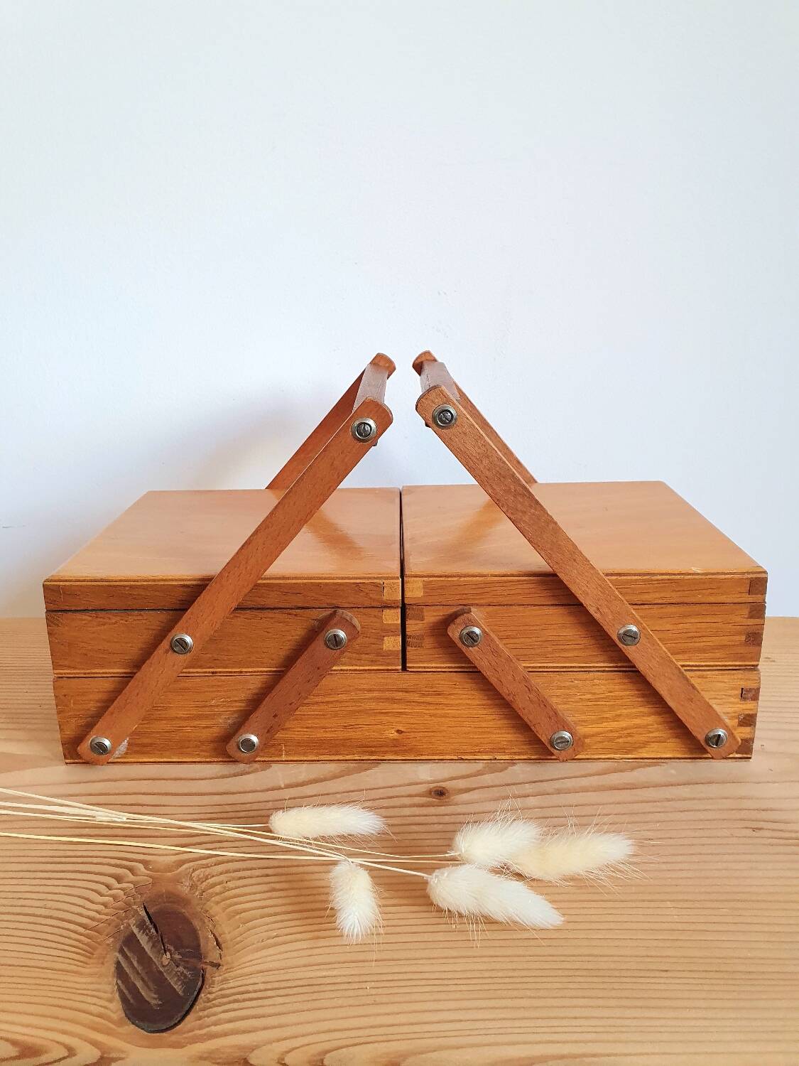 Small wooden sewing worker