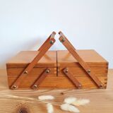 Small wooden sewing worker