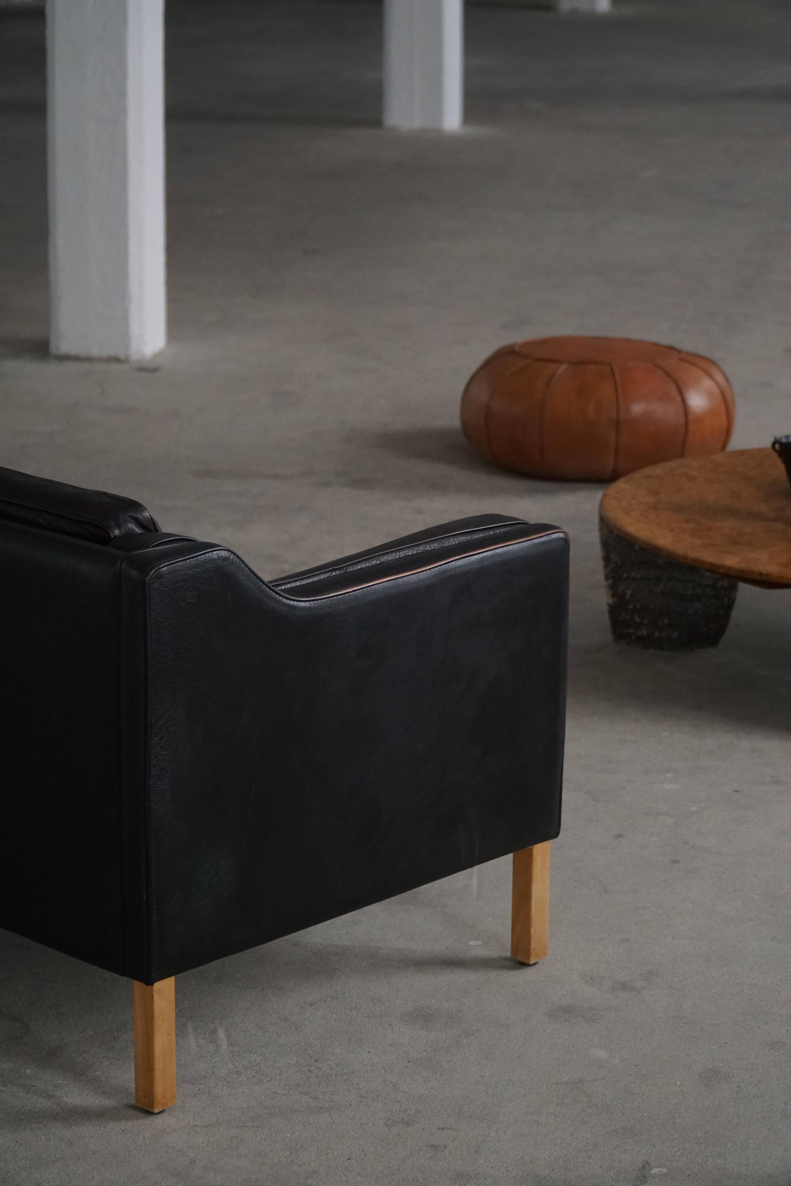 Mogens Hansen, 2-seater canapé mid-century, patinated black leather, 1970s.
