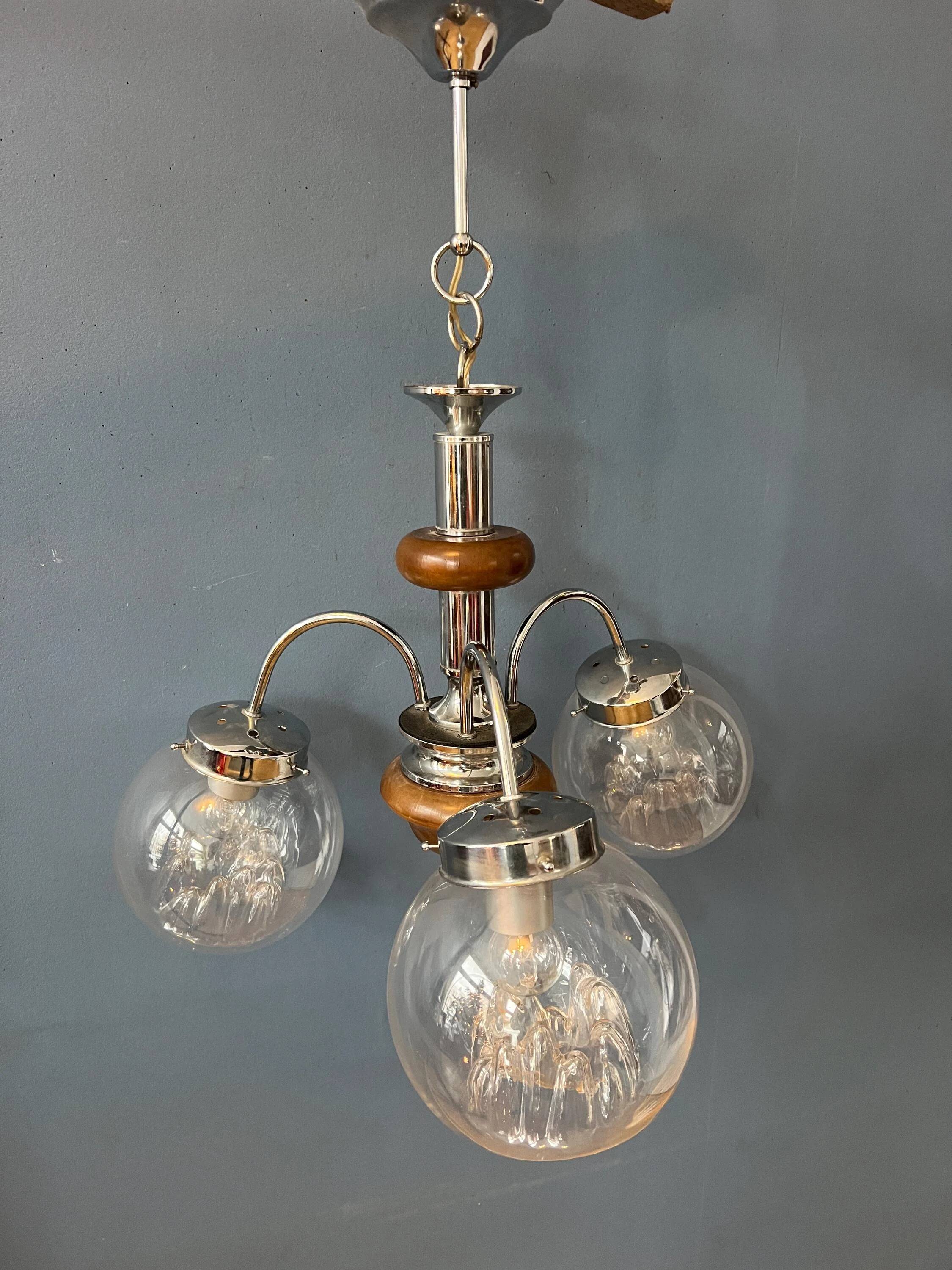 Vintage transparent glass chandelier from Murano with a chrome structure.