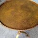Minimalist brutalist gold metal pedestal table