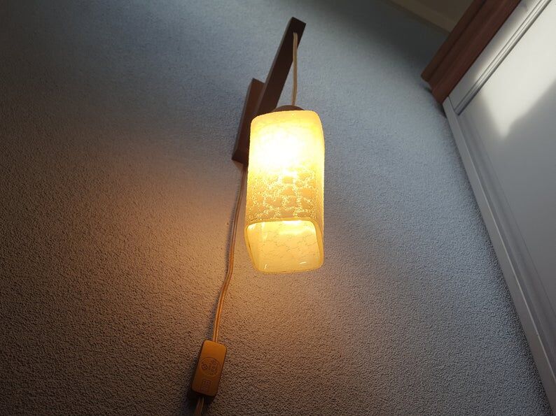 Wooden applique with 60s glass blind