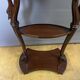 Mahogany bedside table with swan neck.