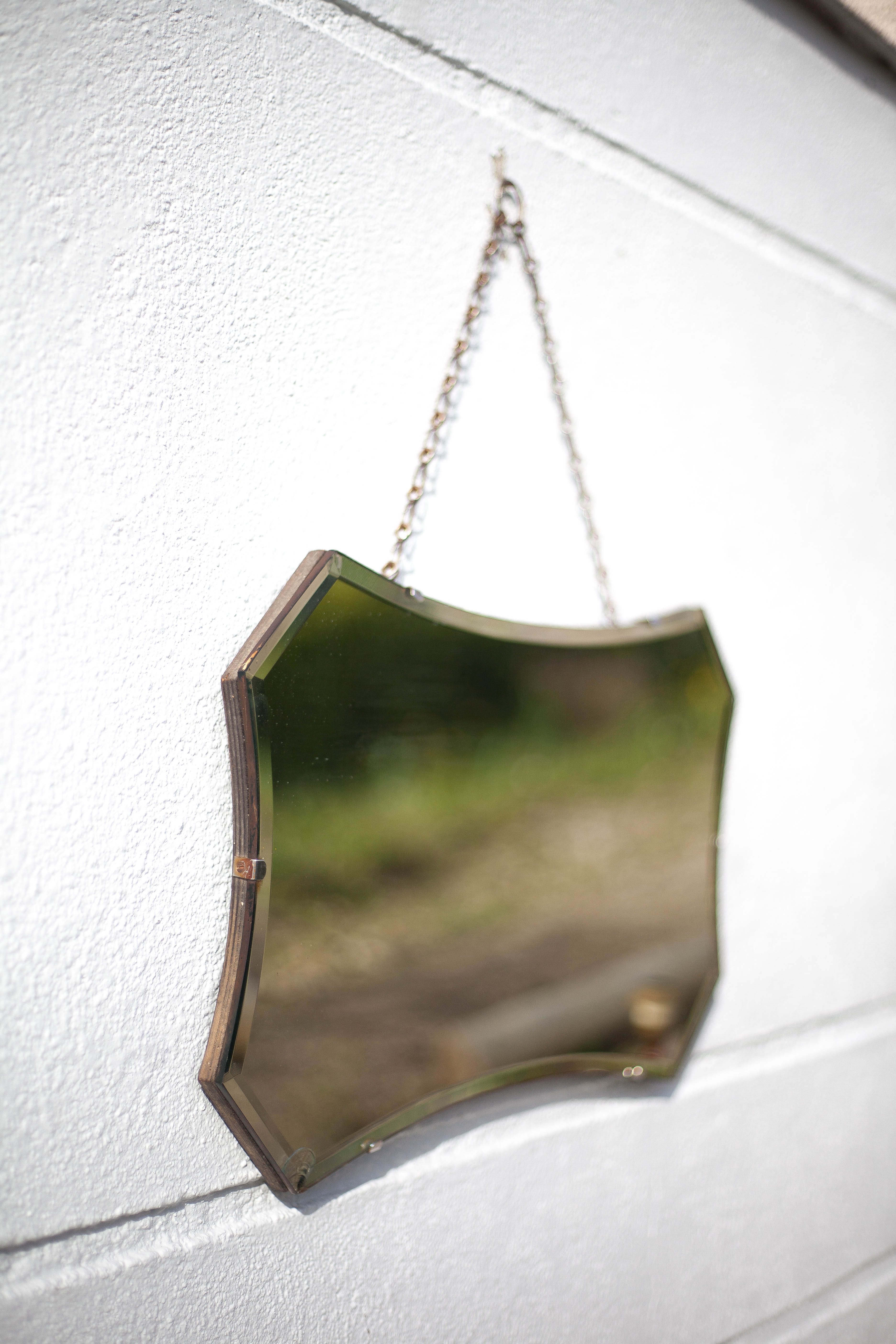 Vintage wall mirror with beveled chain