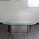 Vintage coffee table with glass and chrome metal.