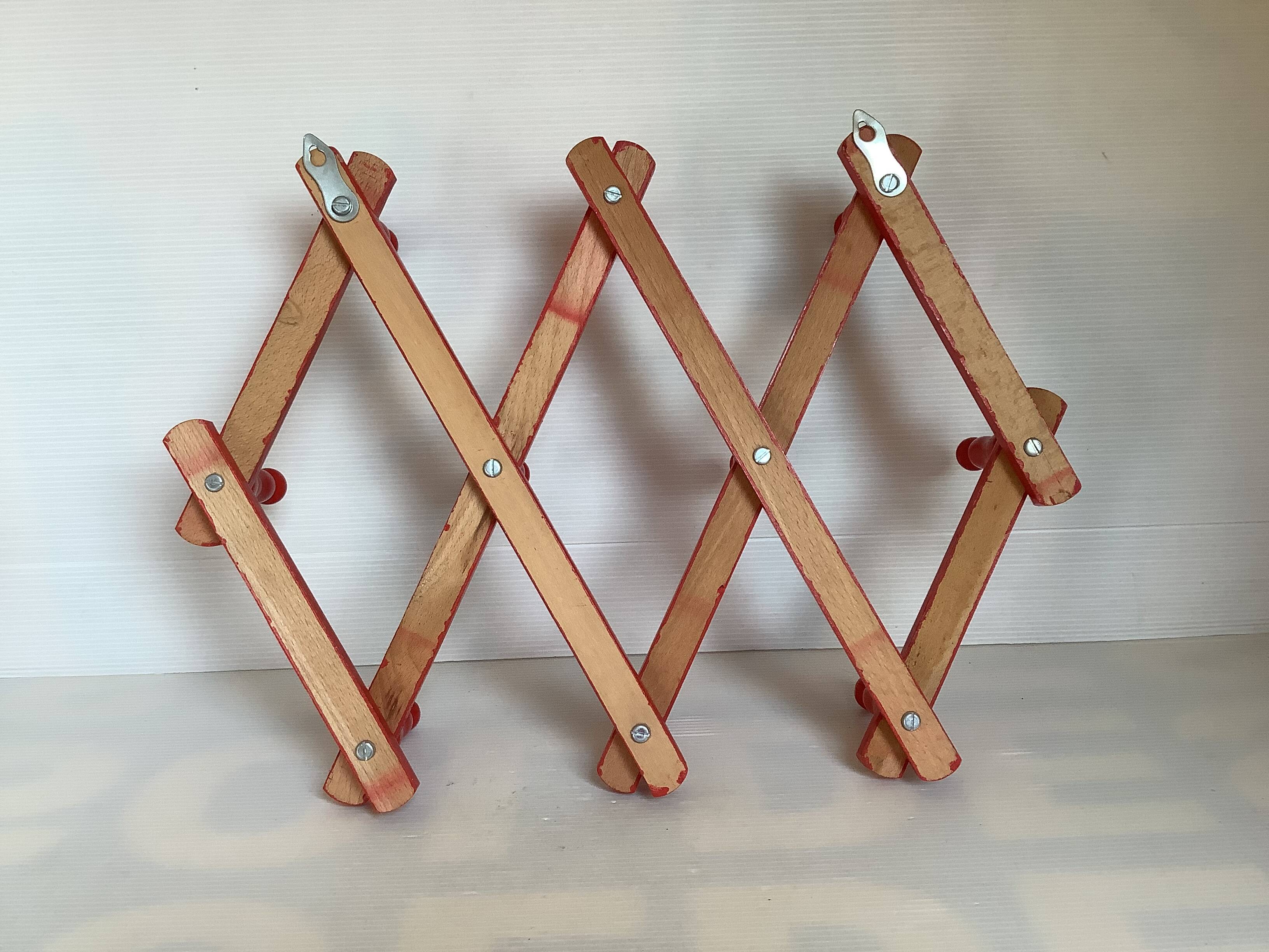 Red wood accordion coat rack