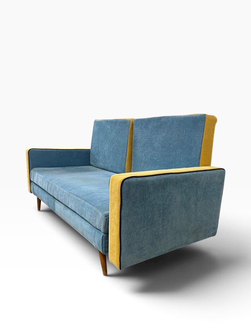Vintage blue armchair/daybed/sofa bed with yellow accents.