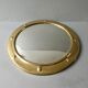 Curved mirror, in a brass porthole, 70s