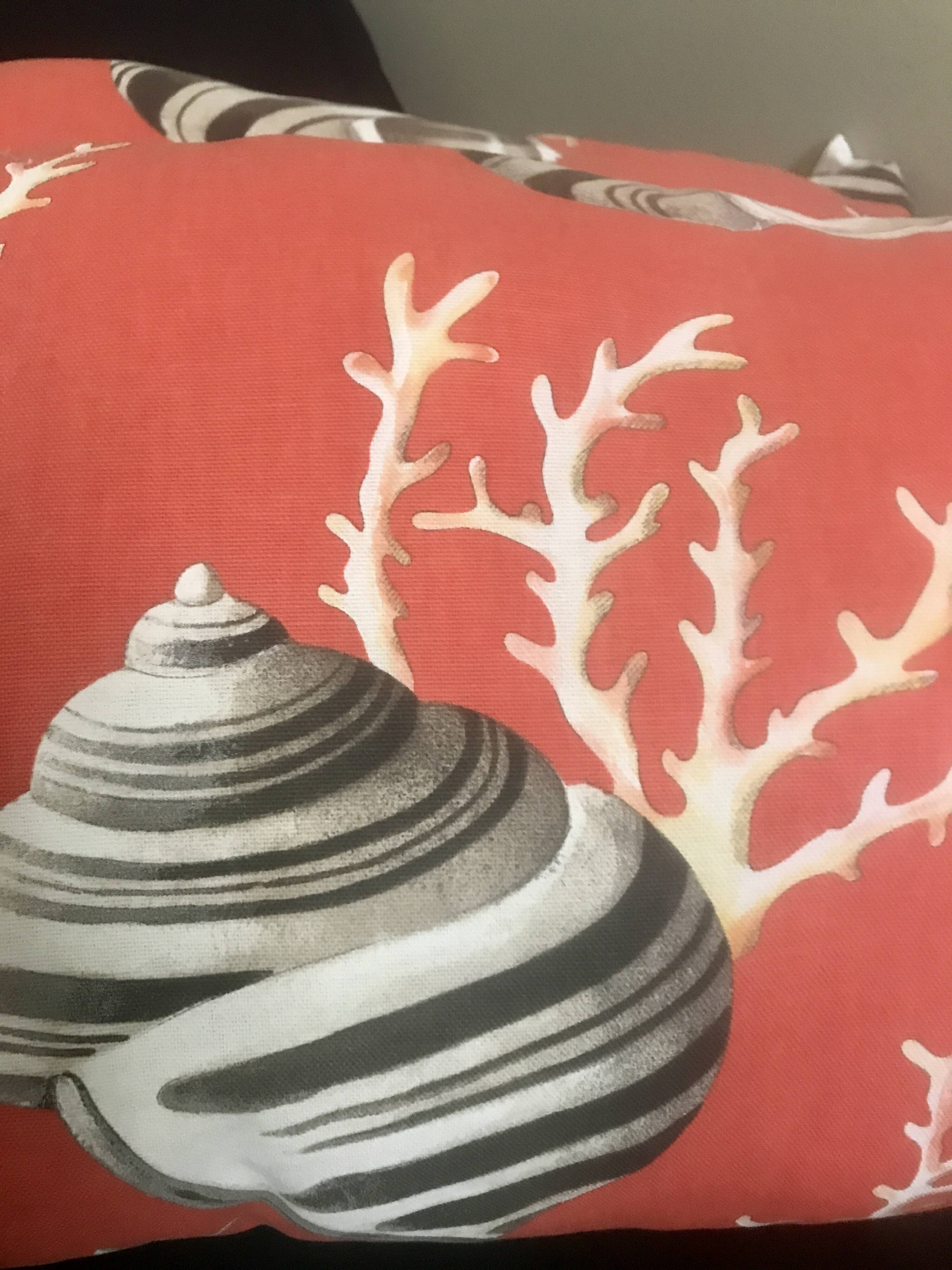 Coral and shell cushion
