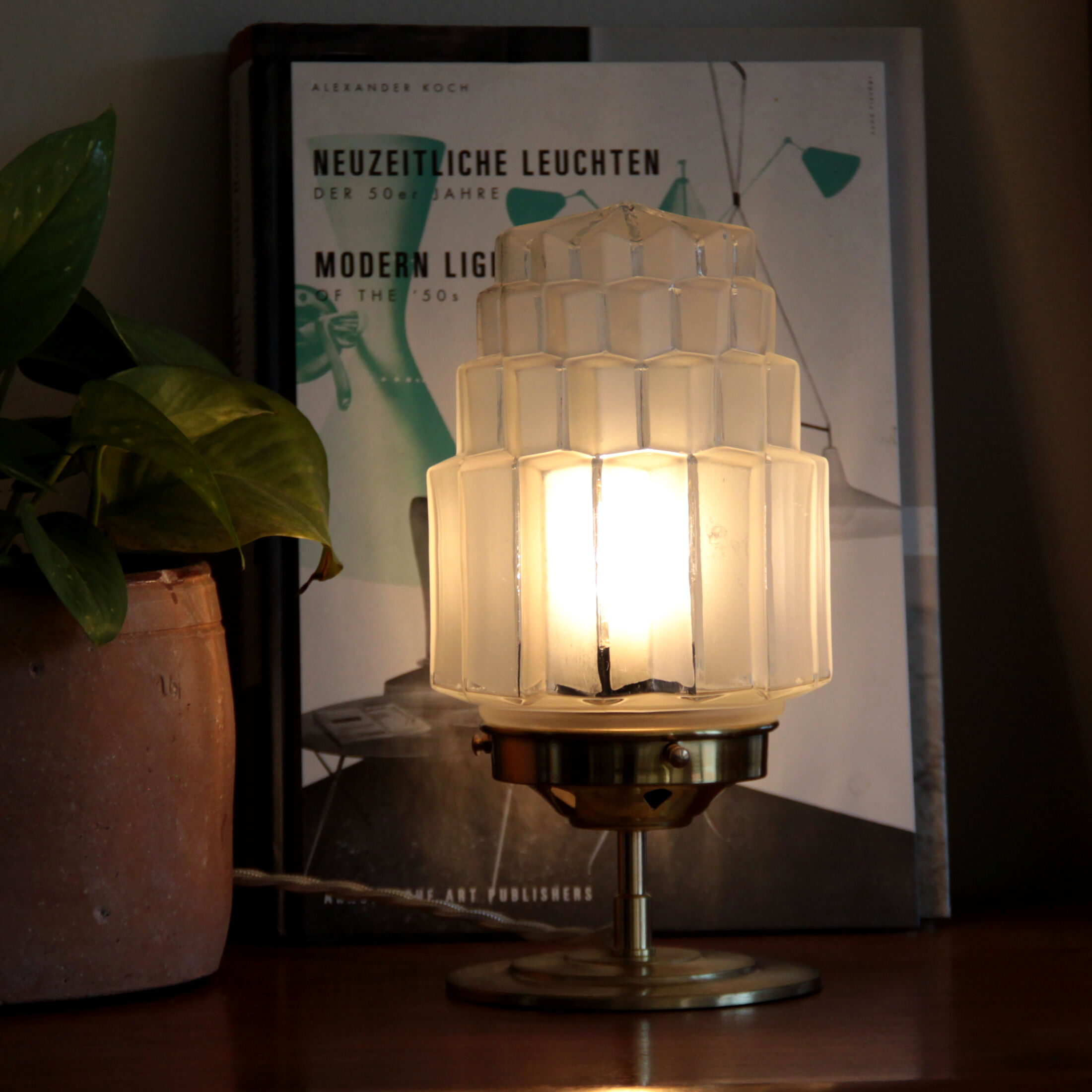 Table lamp in old glass art deco skyscraper and brass vintage bedside lamp
