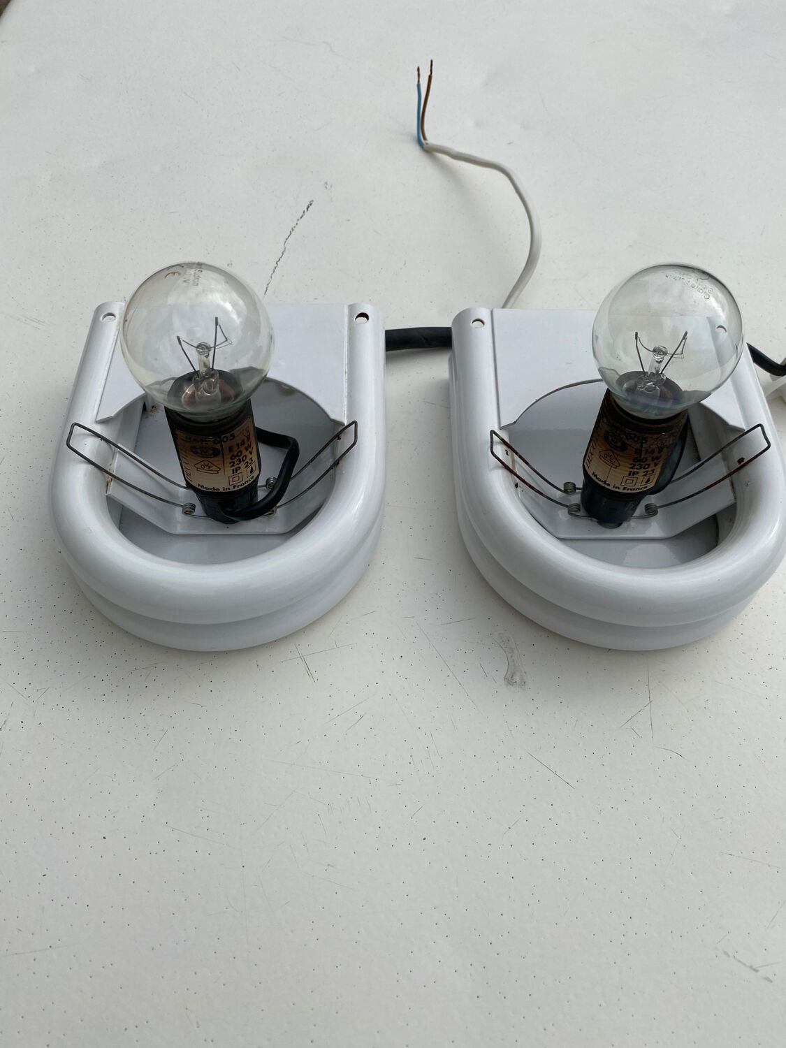 Pair of white and opaline metal wall lights